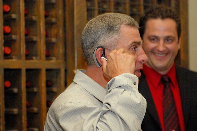 General John Abizaid and Shaun Masterman (Headsets.com) . General Abizaid is trying the Plantronics Voyager 510 headset.