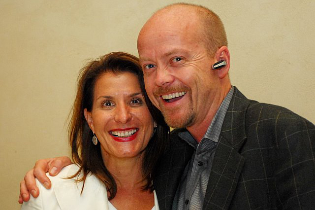 Peggy Kathryn Farnea (Plantronics) and Mike Faith (CEO, Headsets.com) who is wearing a Plantronics Discovery 655 Bluetooth Headset